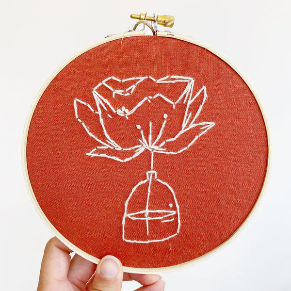 embroidery of flower in a bottle