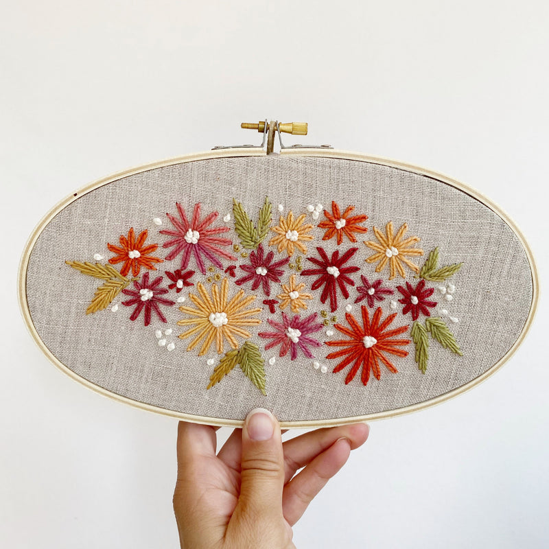 Floral embroidery on natural linen fabric