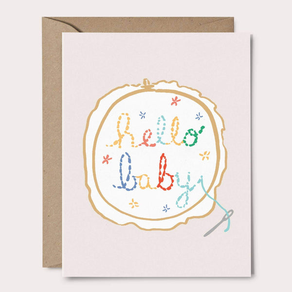 Baby greeting card with 'hello baby' stitched in embroidery hoop