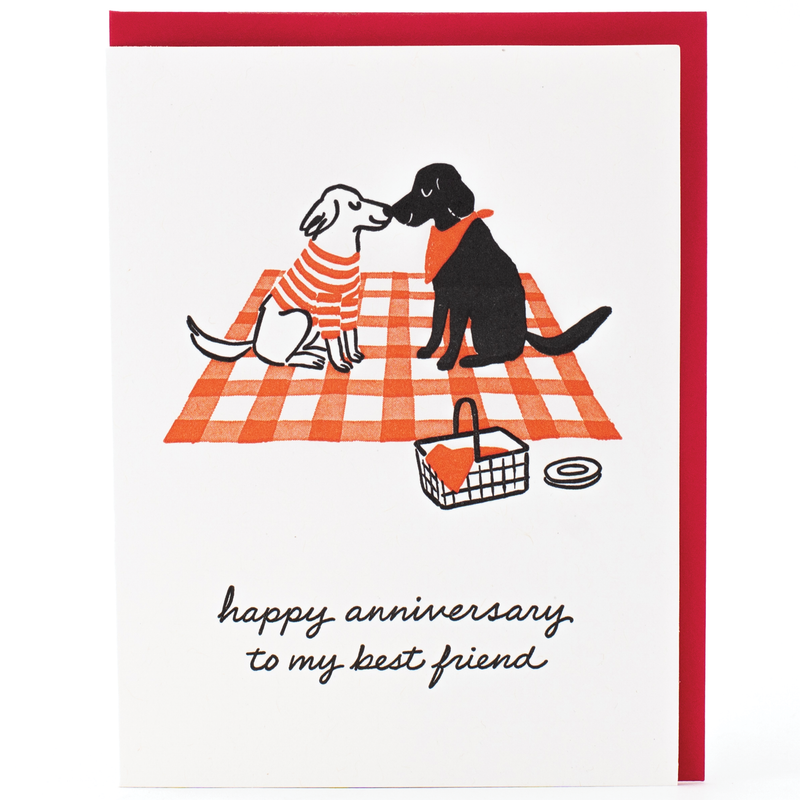 anniversary card featuring dogs on a picnic blanket and text that reads "happy anniversary to my best friend"