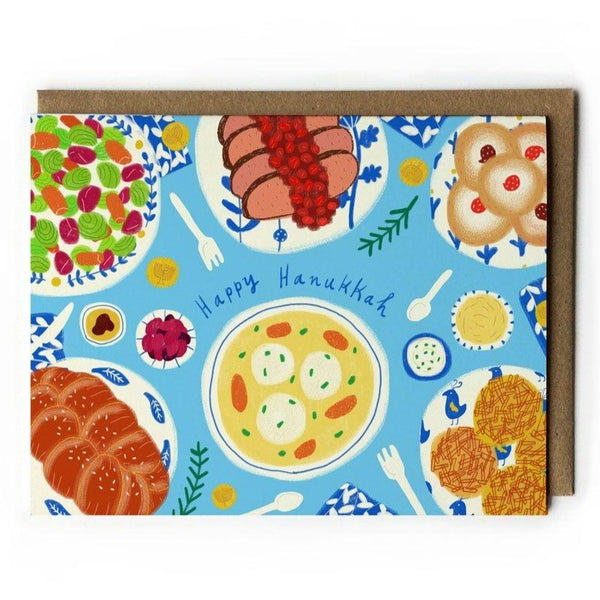 Greeting card featuring a Hanukkah Dinner Table spread with food