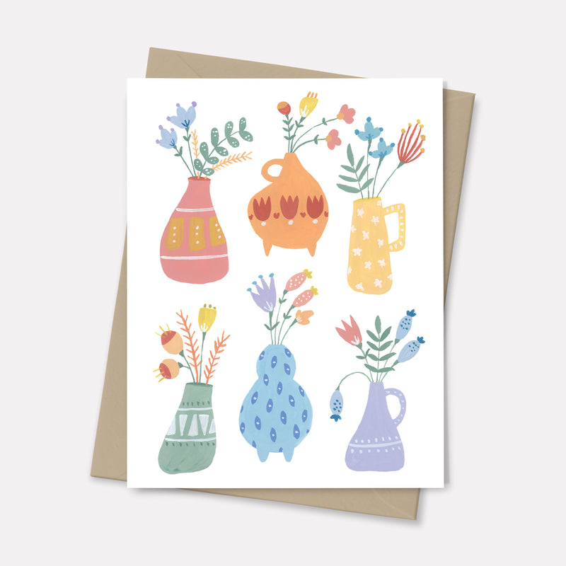 greeting card featuring rainbow vases with flowers